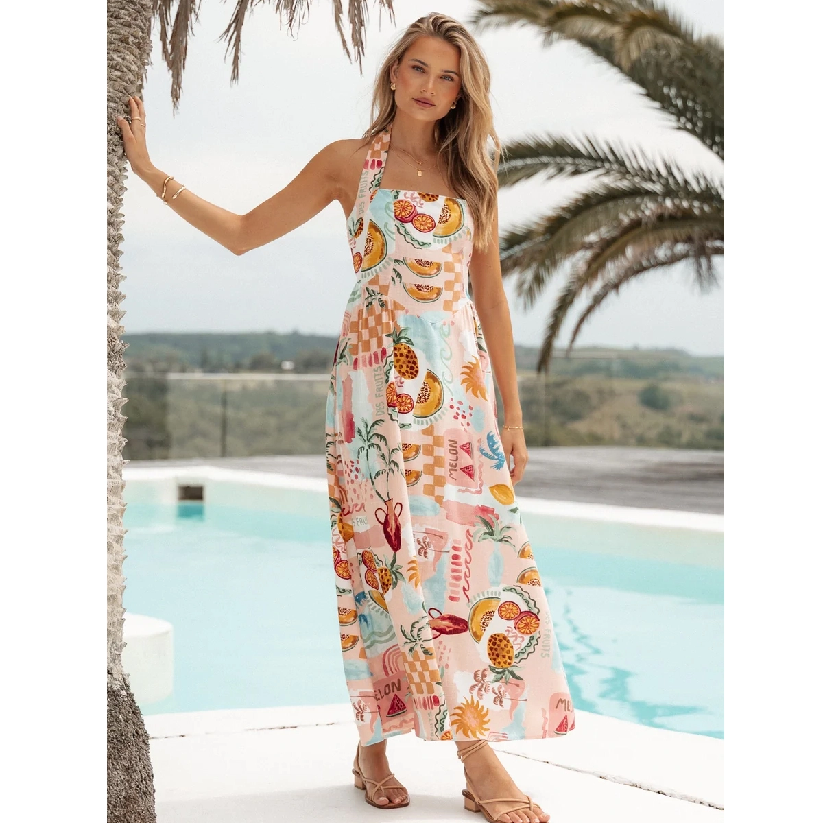 linen blend print summer midi dress with halter neckline front pleat detail and a line skirt design