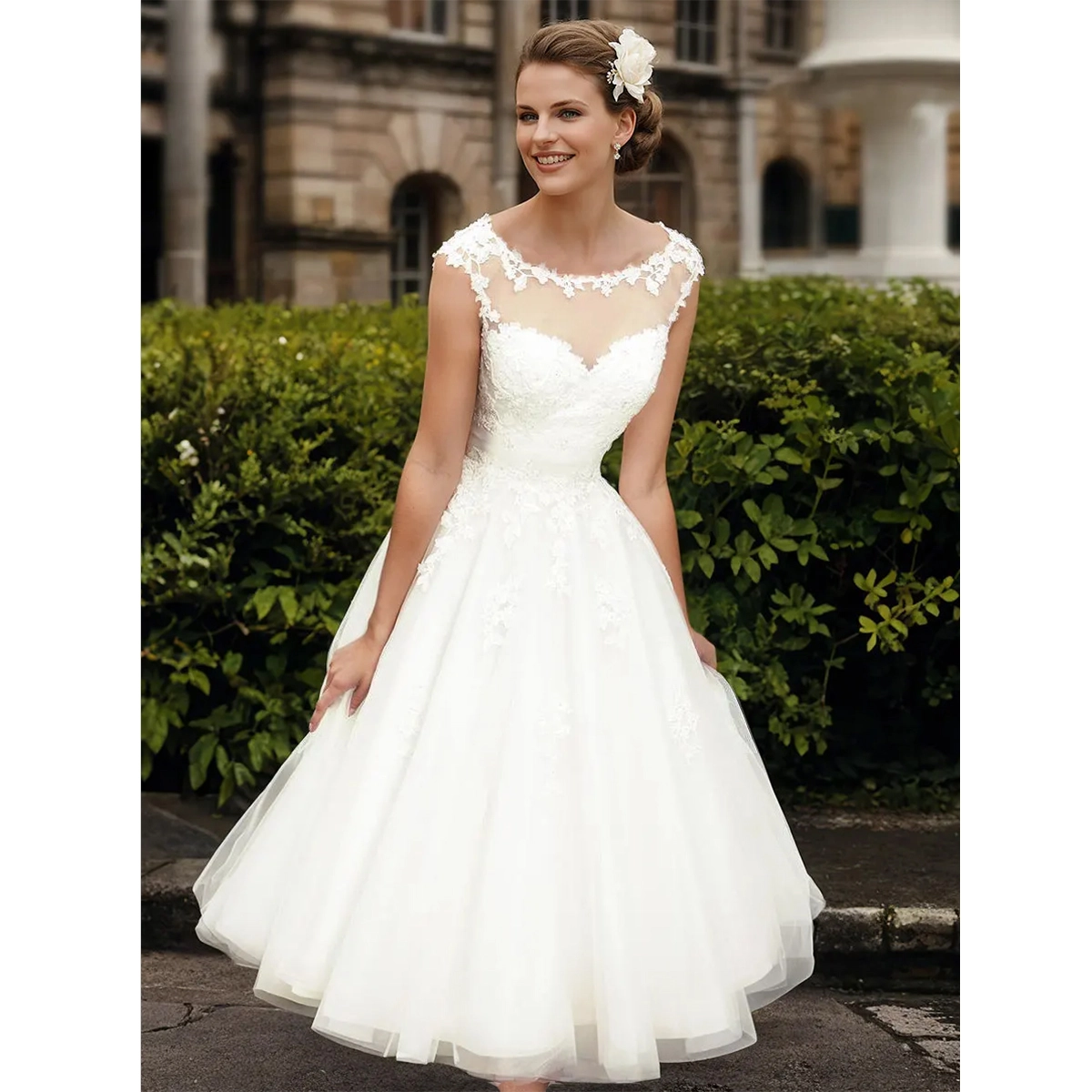 vintage short lace wedding dress with tea length silhouette scoop neckline and lace applique details