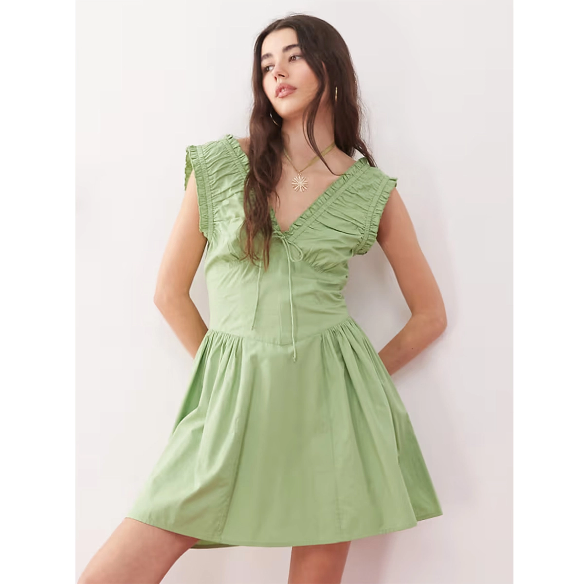 green vintage summer dress with ruched detailing v neckline front tie detail and cinched waist