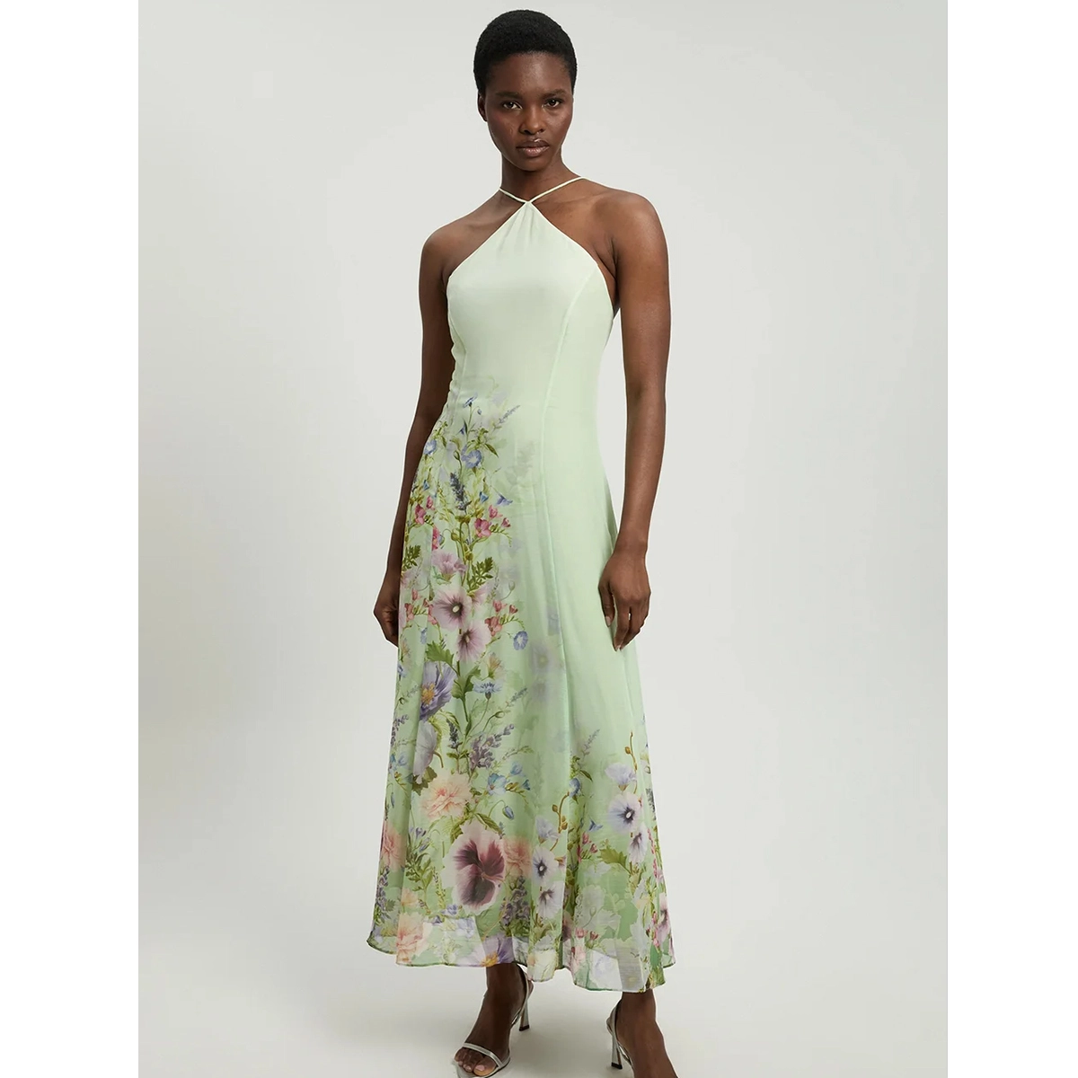 chiffon floral print wedding guest dress with halterneck strappy neckline detail fitted bodice elegant silhouette dress manufacturer wholesale supplier