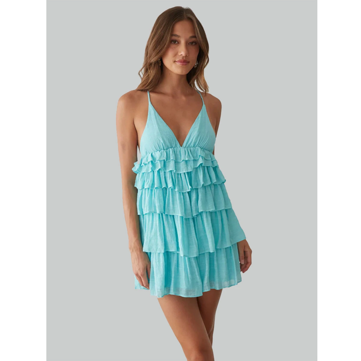 aqua mini dress with v neckline tiered ruffle skirt open back adjustable tie detail