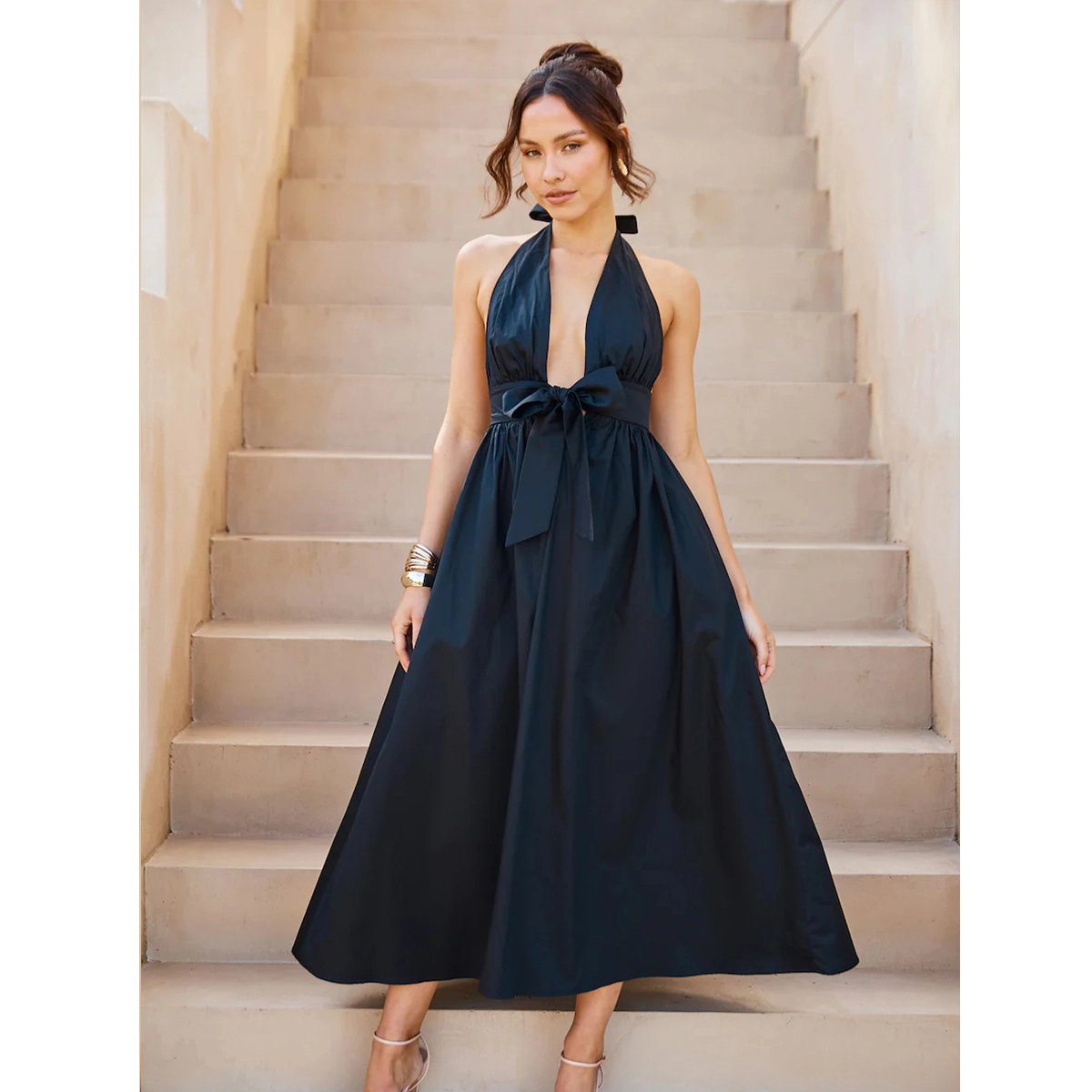black halter midi dress with plunge neckline bow tie waist gathered bust and full skirt