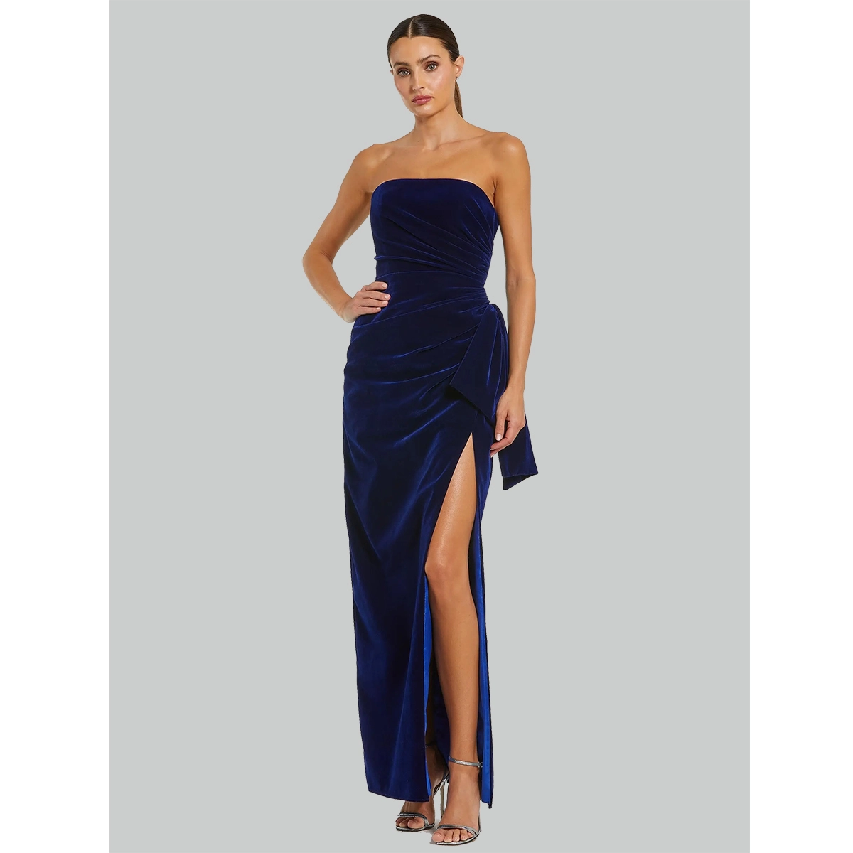 royal blue velvet strapless evening gown with ruched waist side bow detail and high thigh slit